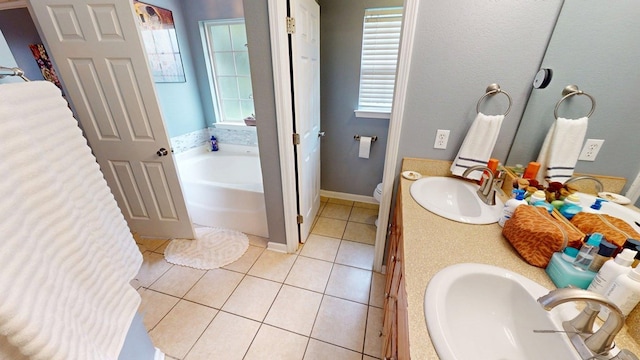 106 Hayden Way, Thomasville, GA 31792 - bathroom with tile patterned floors, a garden tub, double vanity, and toilet