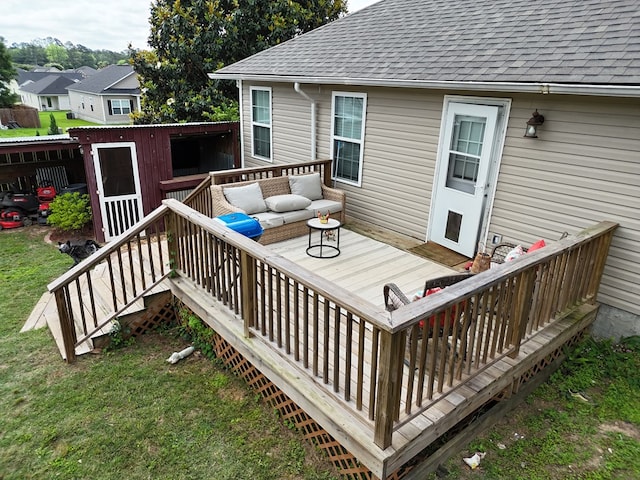 106 Hayden Way, Thomasville, GA 31792 - deck with outdoor lounge area, a lawn, and an outdoor structure