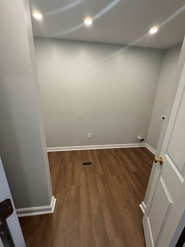 spare room with dark wood-type flooring