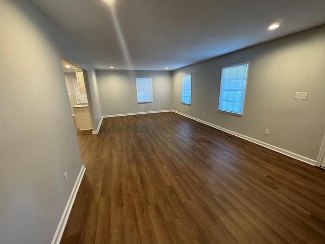 spare room featuring dark hardwood / wood-style floors