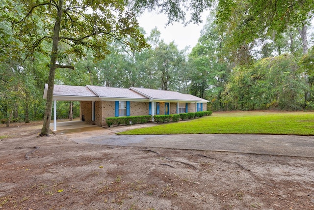 ranch-style house with a front yard and a carport