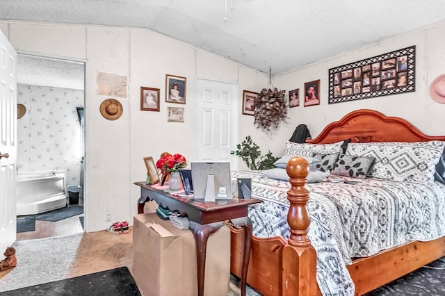 bedroom featuring lofted ceiling, a textured ceiling, and carpet