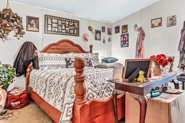 bedroom with carpet and a textured ceiling