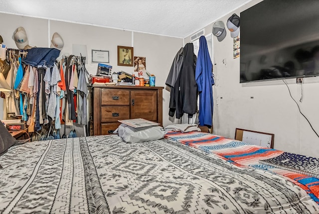 bedroom featuring a textured ceiling