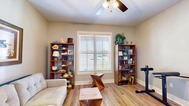 sitting room featuring light wood-type flooring and ceiling fan