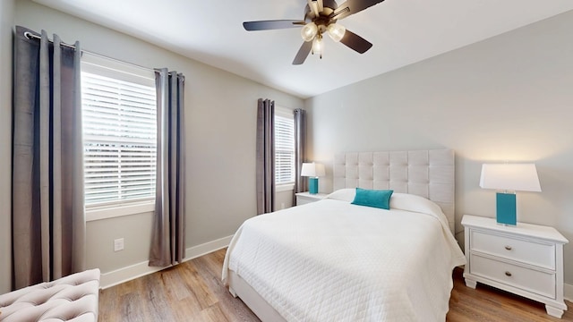 bedroom featuring ceiling fan and light wood-type flooring