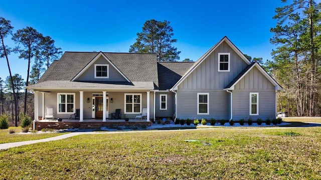 view of front facade with a front lawn and a porch