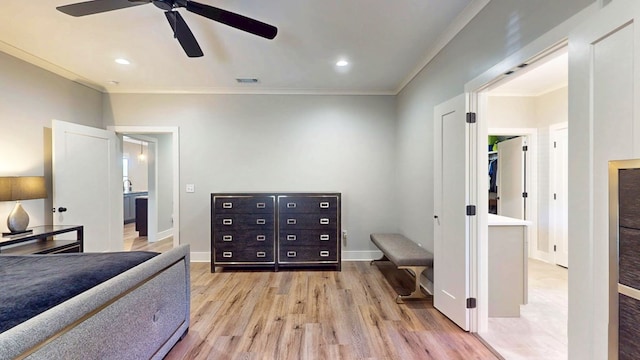 bedroom with ceiling fan, ornamental molding, and light hardwood / wood-style flooring