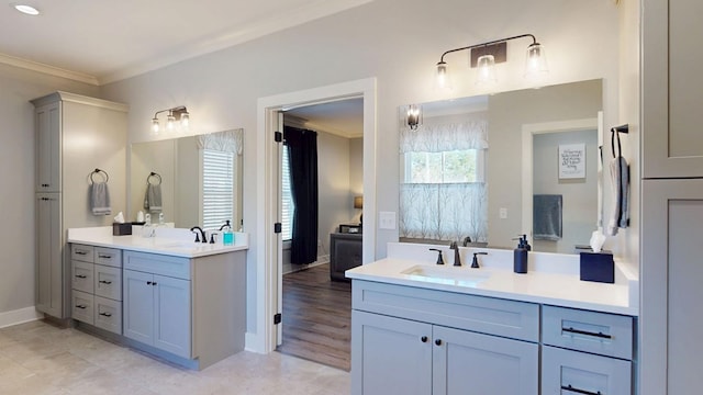 bathroom with vanity and crown molding