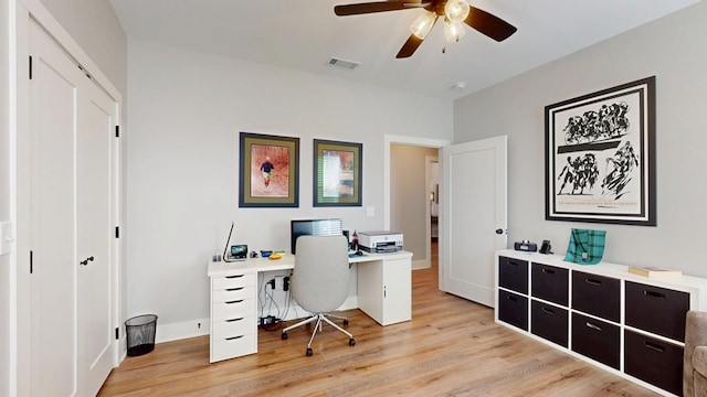 office with ceiling fan and light hardwood / wood-style floors