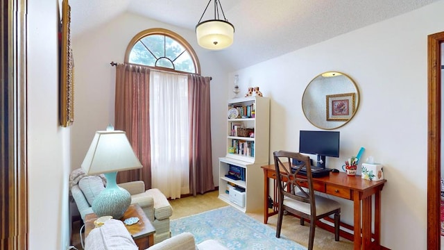 home office featuring vaulted ceiling and light carpet