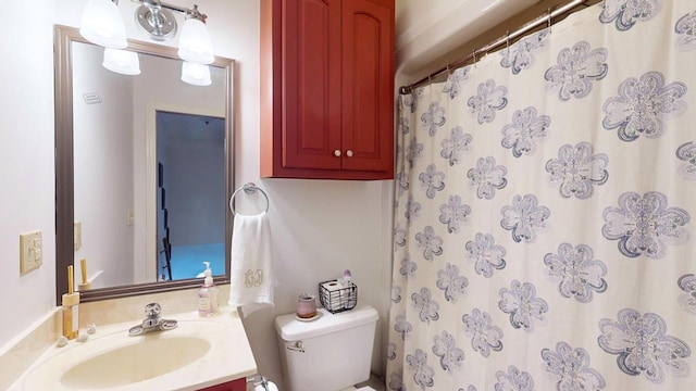 bathroom with vanity, toilet, and a shower with curtain