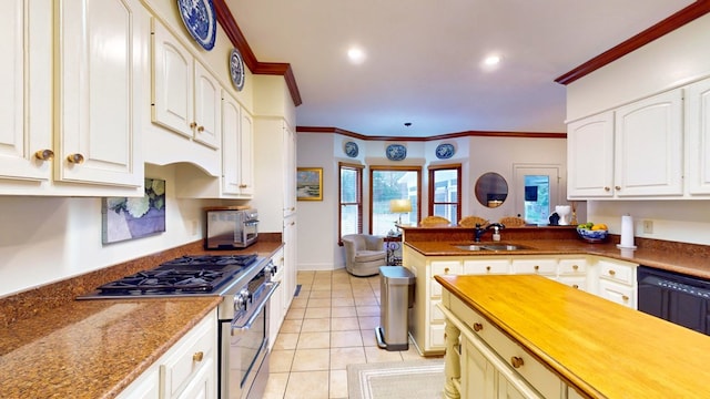 kitchen with light tile patterned floors, a peninsula, a sink, high end stainless steel range, and crown molding