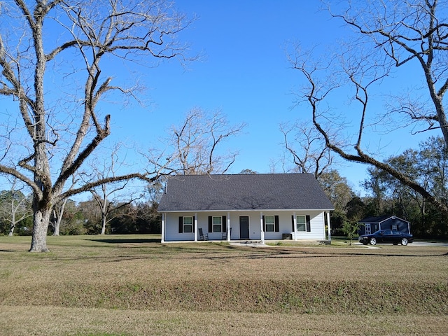 ranch-style house featuring a front lawn and a porch