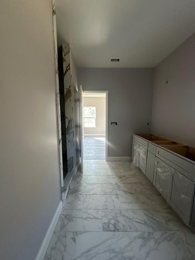 bathroom featuring marble finish floor, visible vents, a shower stall, and baseboards