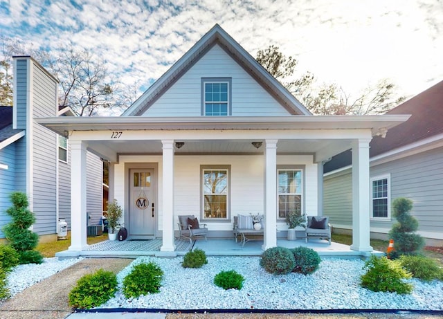 exterior space featuring a porch and central air condition unit