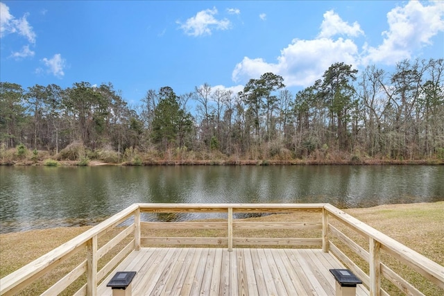 dock area with a deck with water view