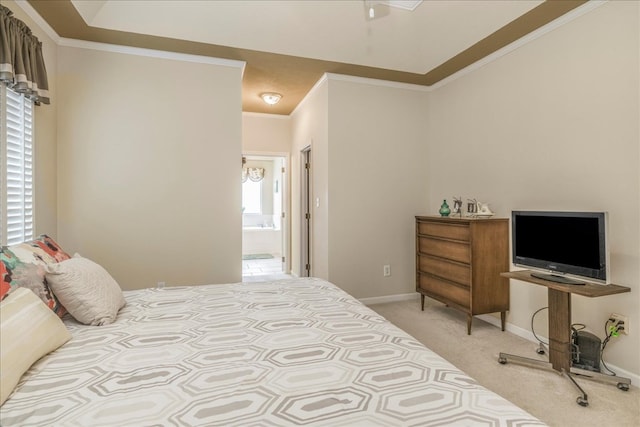 bedroom featuring light carpet, baseboards, connected bathroom, and crown molding