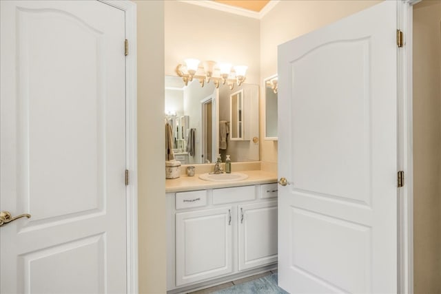 bathroom featuring crown molding and vanity