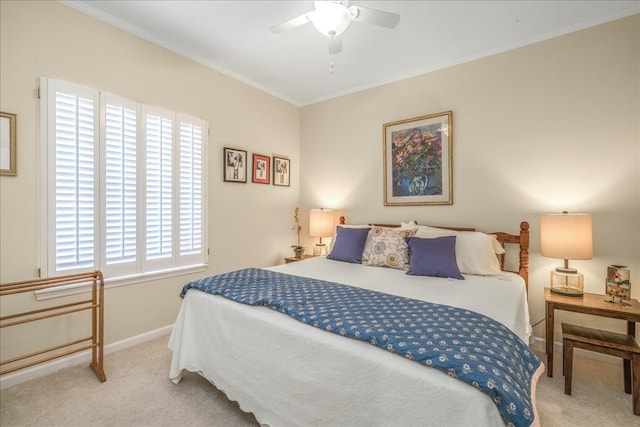 bedroom featuring baseboards, ceiling fan, carpet flooring, and crown molding