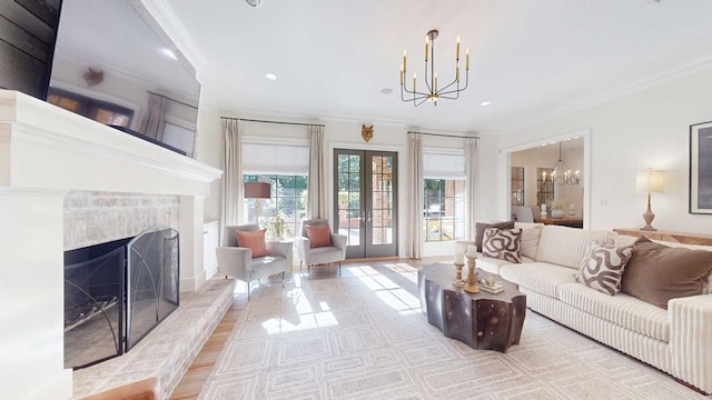 7827 Metcalf Rd, Thomasville, GA 31792 - living room with a chandelier, crown molding, a premium fireplace, french doors, and recessed lighting