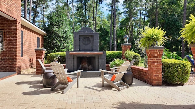 7827 Metcalf Rd, Thomasville, GA 31792 - view of patio featuring an outdoor brick fireplace