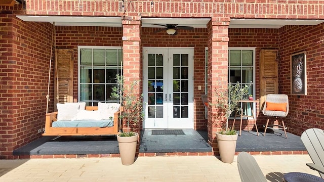 7827 Metcalf Rd, Thomasville, GA 31792 - view of exterior entry featuring french doors, brick siding, and a patio