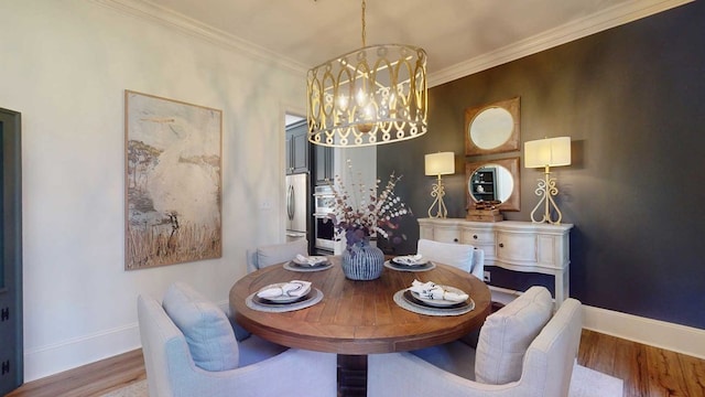 7827 Metcalf Rd, Thomasville, GA 31792 - dining room featuring a chandelier, wood finished floors, and crown molding