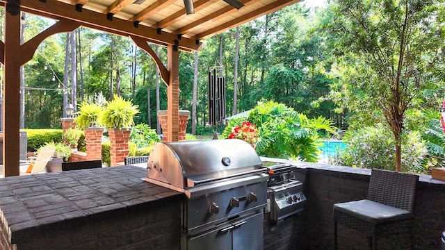 7827 Metcalf Rd, Thomasville, GA 31792 - view of patio / terrace featuring an outdoor kitchen