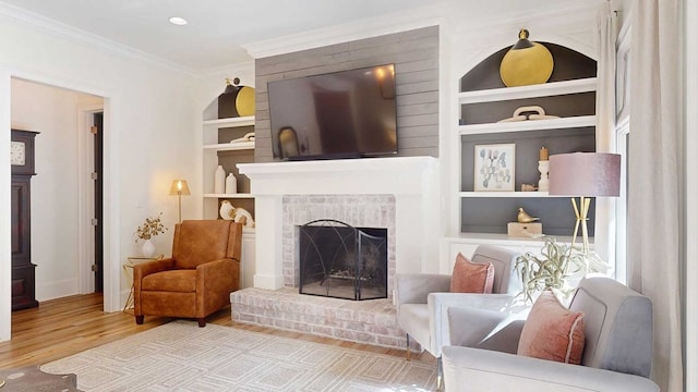 7827 Metcalf Rd, Thomasville, GA 31792 - living area featuring built in features, wood finished floors, ornamental molding, and a fireplace
