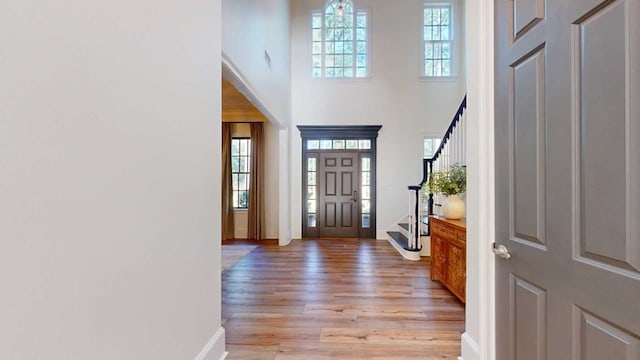 7827 Metcalf Rd, Thomasville, GA 31792 - entryway with stairs, a high ceiling, and light wood finished floors