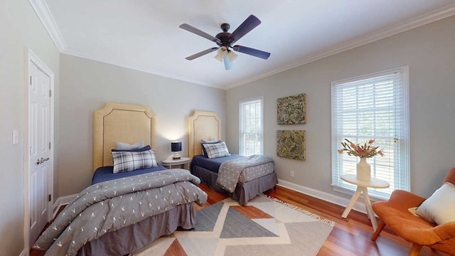 7827 Metcalf Rd, Thomasville, GA 31792 - bedroom with ornamental molding, wood finished floors, and a ceiling fan