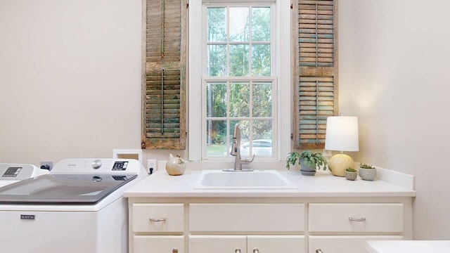 7827 Metcalf Rd, Thomasville, GA 31792 - laundry area featuring cabinet space, washing machine and clothes dryer, and healthy amount of natural light