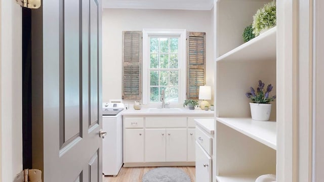 7827 Metcalf Rd, Thomasville, GA 31792 - laundry room featuring washer / dryer and light wood finished floors