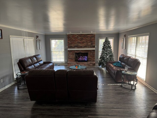 living room featuring a brick fireplace, crown molding, and dark hardwood / wood-style floors