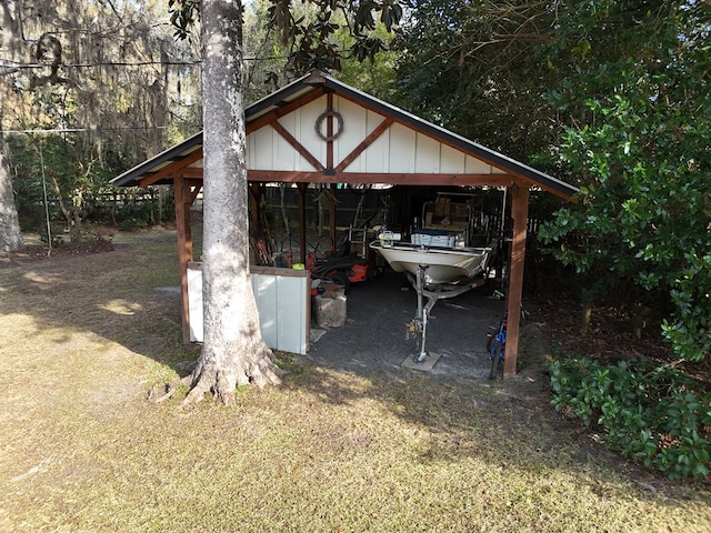 view of outbuilding with a carport and an outdoor structure