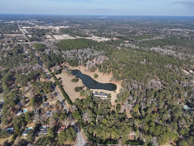 birds eye view of property with a view of trees