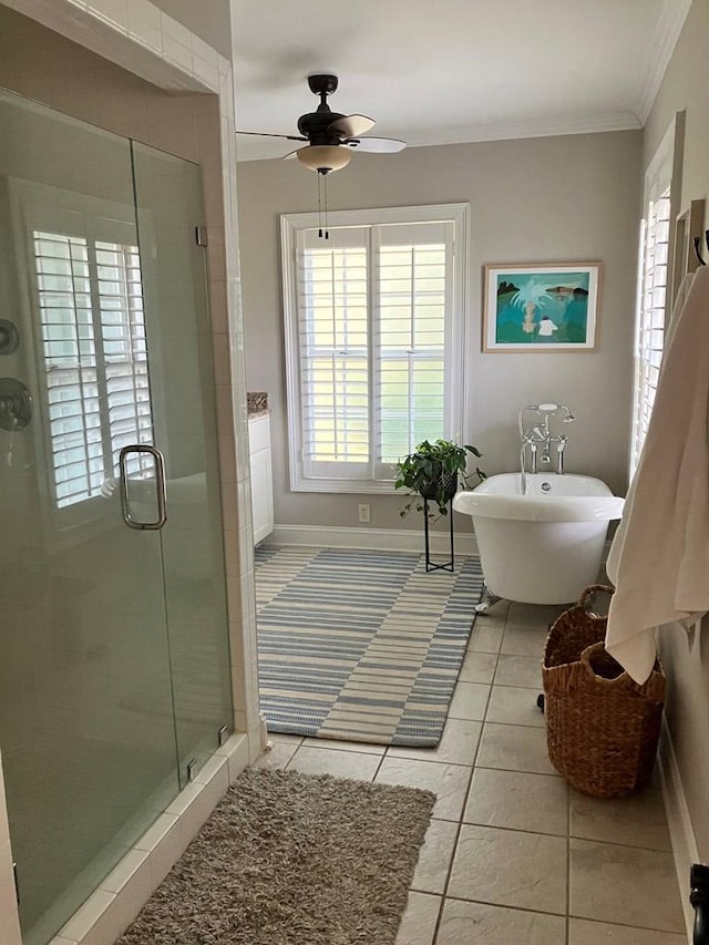 full bath with a freestanding tub, a shower stall, crown molding, and tile patterned flooring