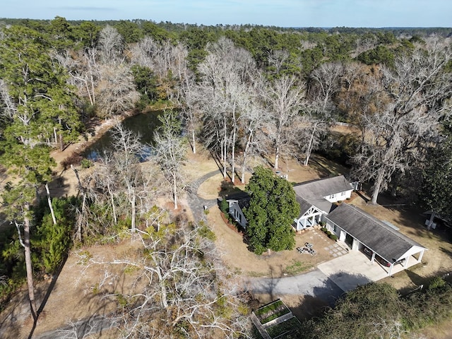 drone / aerial view featuring a view of trees