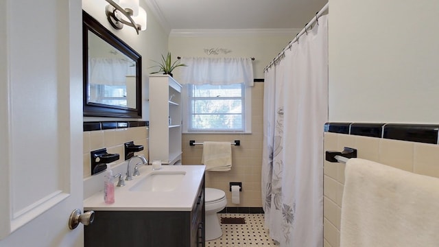 bathroom with tile walls, tile patterned flooring, vanity, toilet, and crown molding