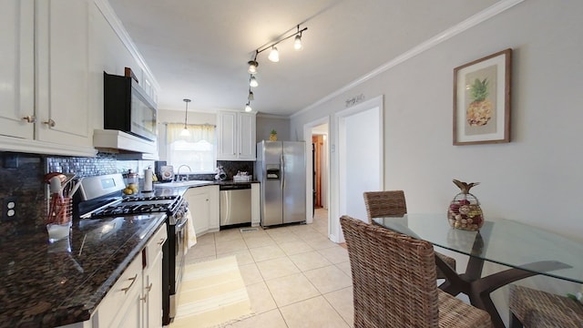 kitchen with sink, white cabinetry, crown molding, appliances with stainless steel finishes, and pendant lighting