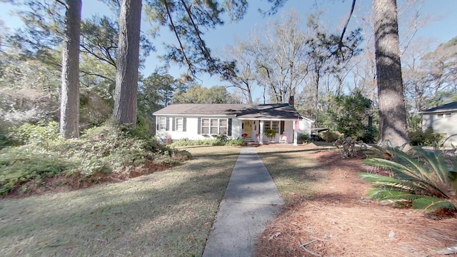 ranch-style home with a front lawn