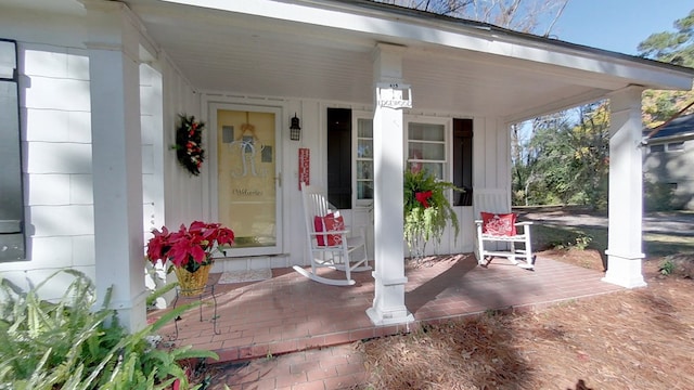 doorway to property featuring a porch