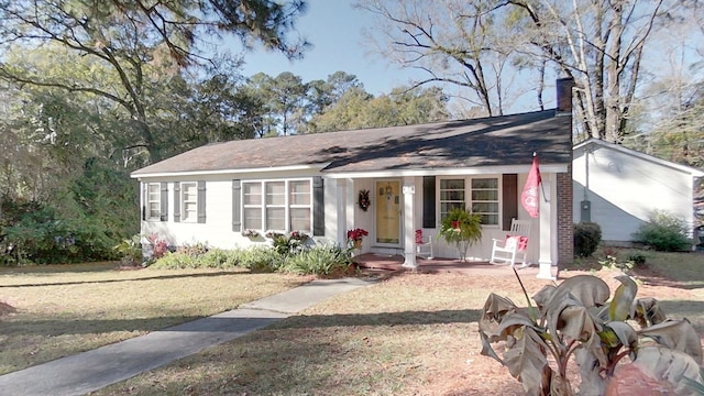 ranch-style house featuring a front yard