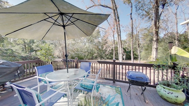 wooden deck featuring area for grilling