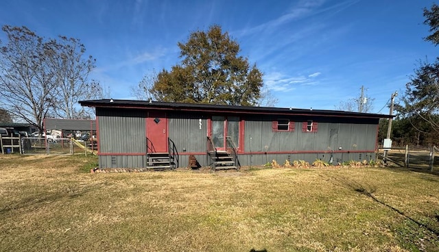 back of house with a yard