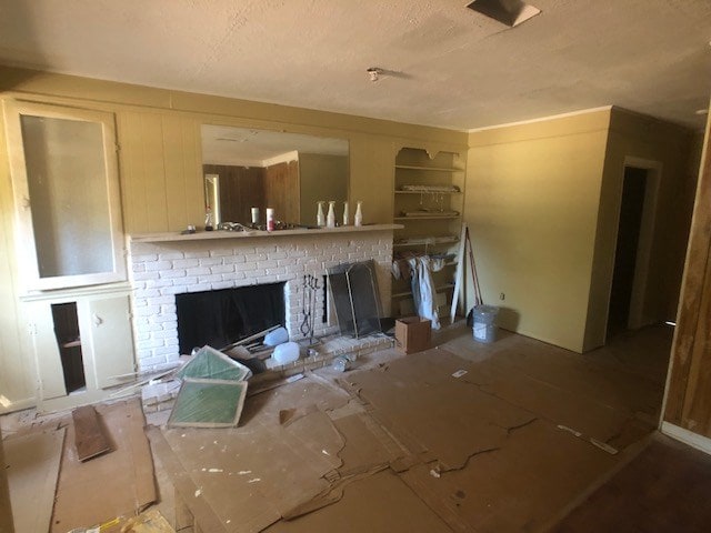 unfurnished living room featuring a fireplace