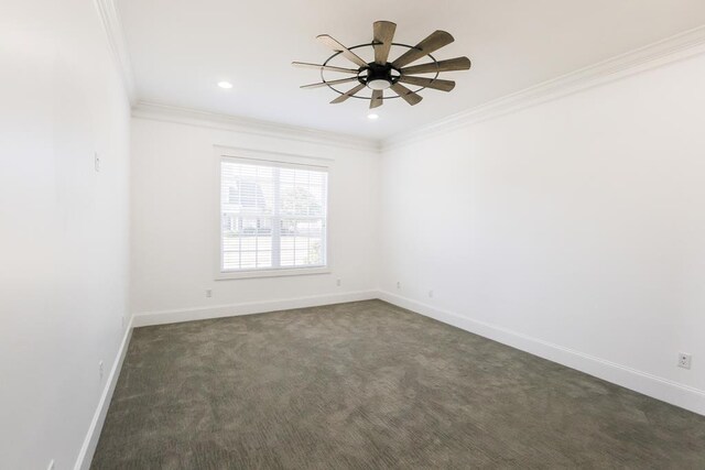 spare room with crown molding, ceiling fan, and dark colored carpet