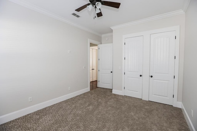 unfurnished bedroom with crown molding, carpet floors, and ceiling fan