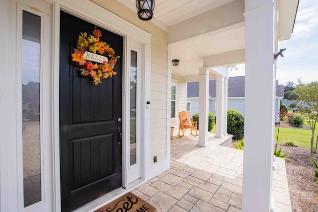 entrance to property featuring covered porch